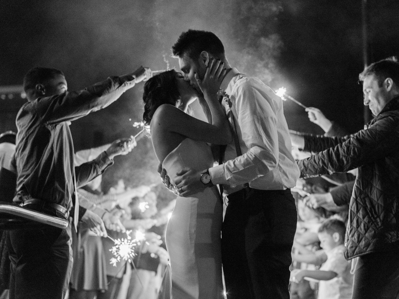 Kissing Sparkler Exit | Warehouse Venue Downtown, The Glass House | Rustic Winter Wedding | Lynchburg, Virginia Film Photographer | kelseyandnate.com