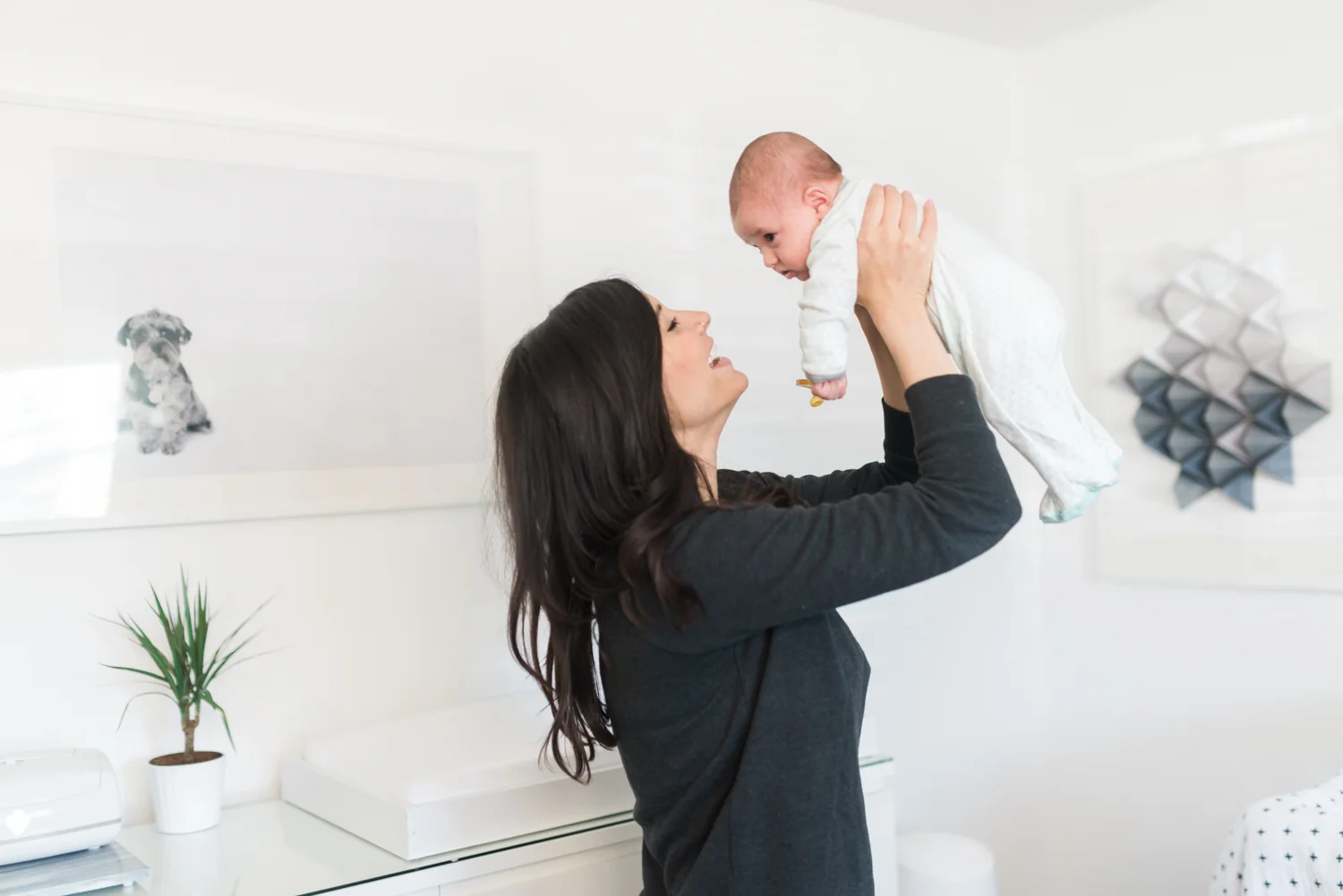 West Elm Inspired Newborn Lifestyle Session | Lynchburg Photographer | Kelsey & Nate | kelseyandnate.com | Gold Bird Mobile | Modern Nursery | White Nursery and Velvet Blue Rocker | Modern Burlap