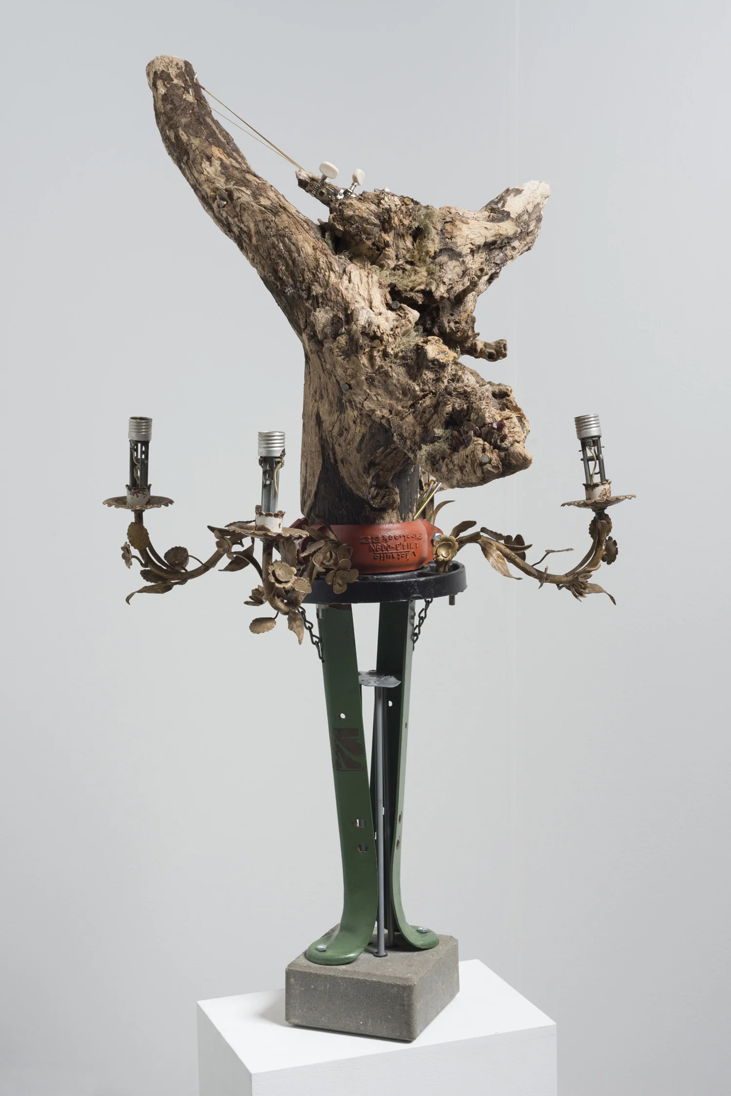 Lorna Williams-spoils-2013-chandelier fixtures, table legs, concrete, chain, plumbing hardware, Spanish moss, ukulele, root system, nails, wasp hive, acrylic, bullet casings-45x20x29(2).jpg