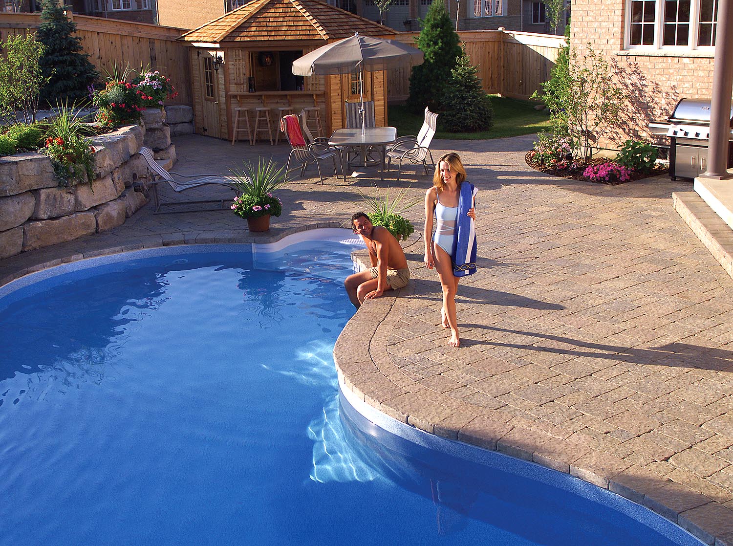 patio pool backyard paradise plantings landscape design hardscape pavers retaining wall