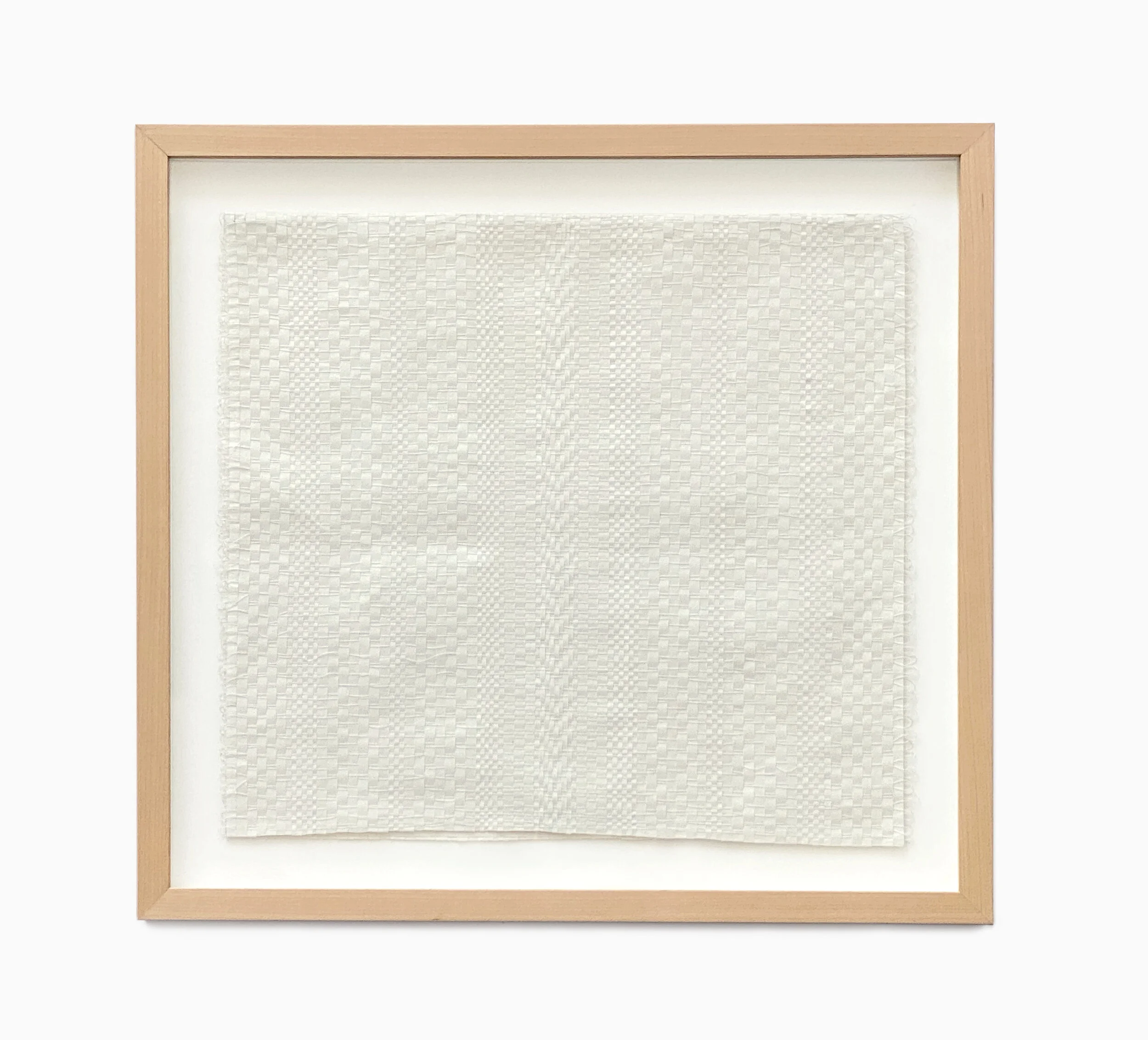 Framed textile art with subtle paper textured pattern on white background.