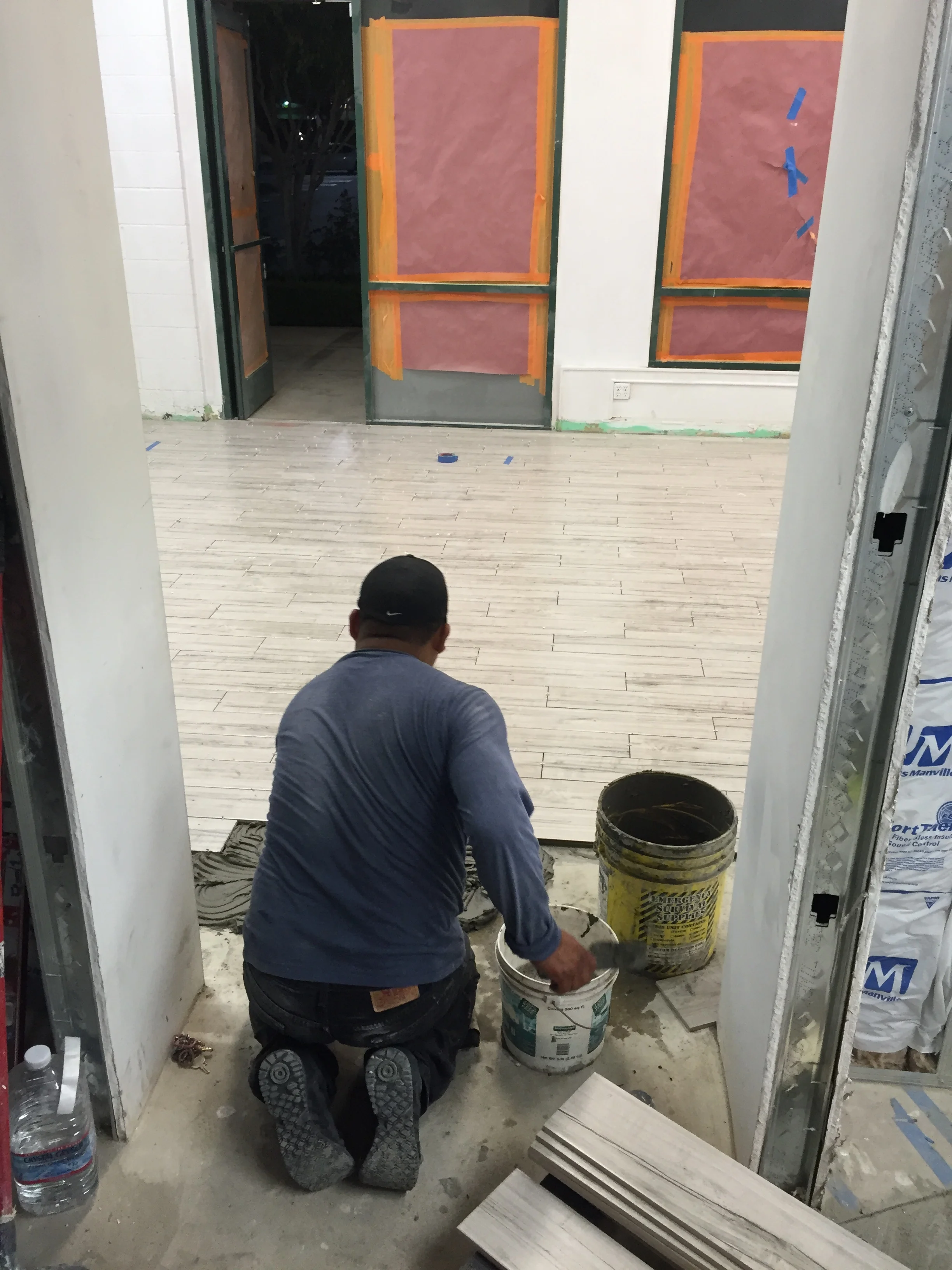 Finishing the tile in the front of house. 