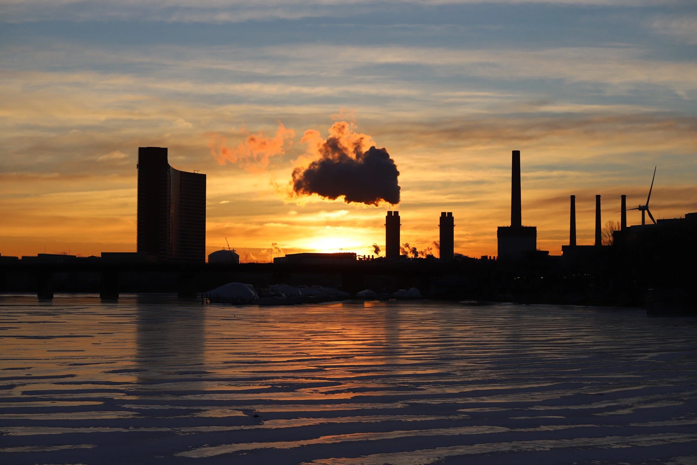 Sunrise over an icy mystic river in Everett, Massachusetts.