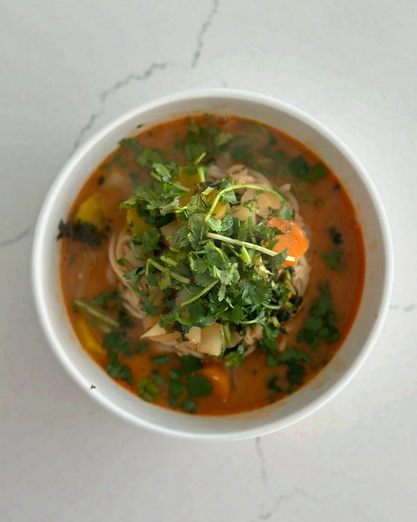 Sometimes, leftovers inspire something even better. Over the weekend, I made peanut sauce noodles, and today, that same sauce transformed a simple bowl of ramen into something special. The nutty, creamy richness of the peanut sauce added unexpected d