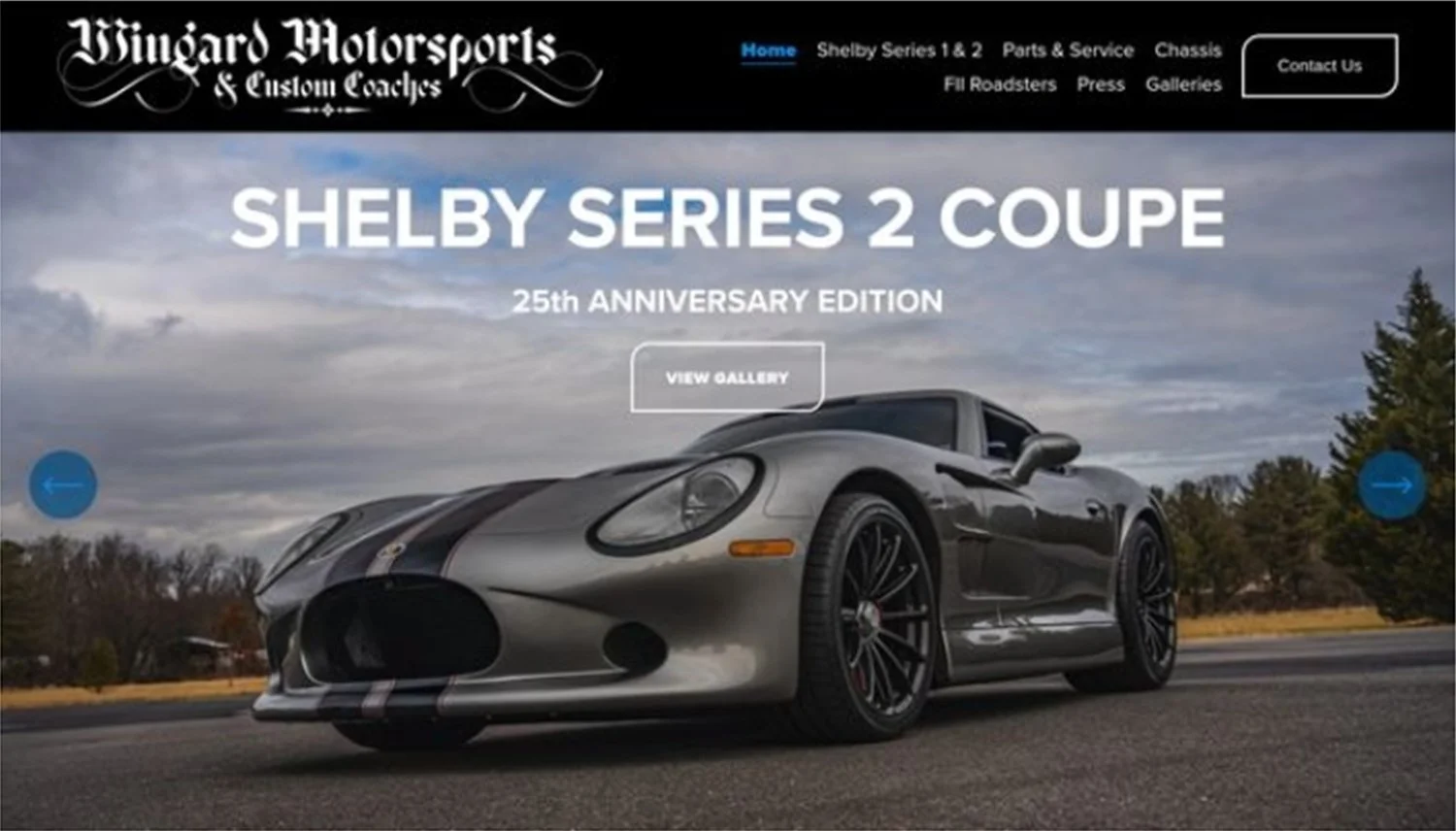 A website homepage for Wingtard Motorsports and Custom Coaches featuring a Shelby Series 2 Coupe car for its 25th anniversary edition. A silver sports car with black stripes on an open road under a cloudy sky with trees in the background.