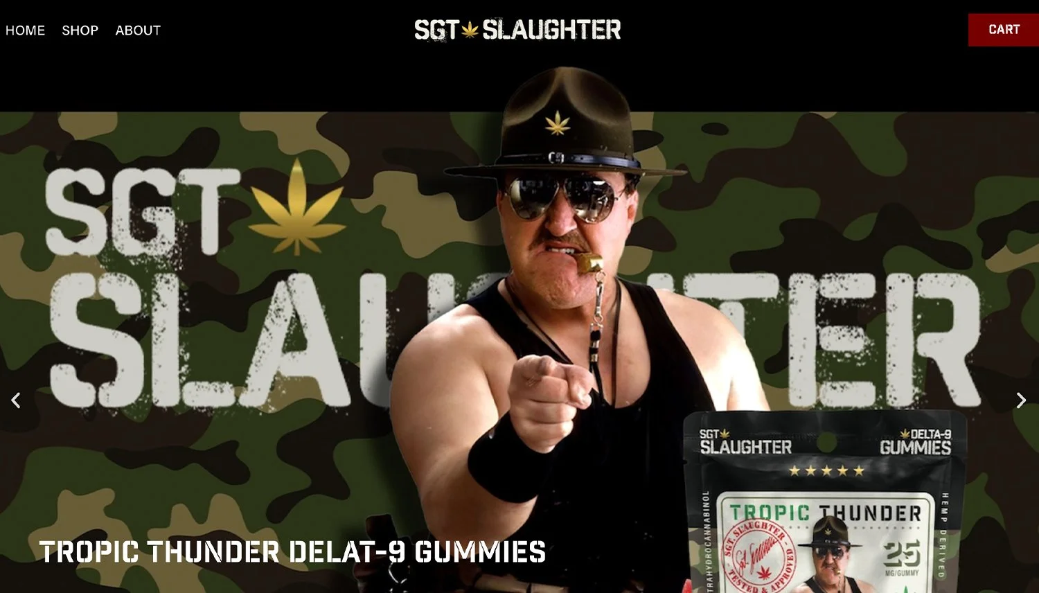 A man dressed as a gangster with a tattoos, black tank top, sunglasses, and a sheriff hat, pointing forward with a serious expression, against a camouflage background with text 'SGT SLaughter' and packaging of Delta-9 gummies labeled 'Tropic Thunder' in the foreground.