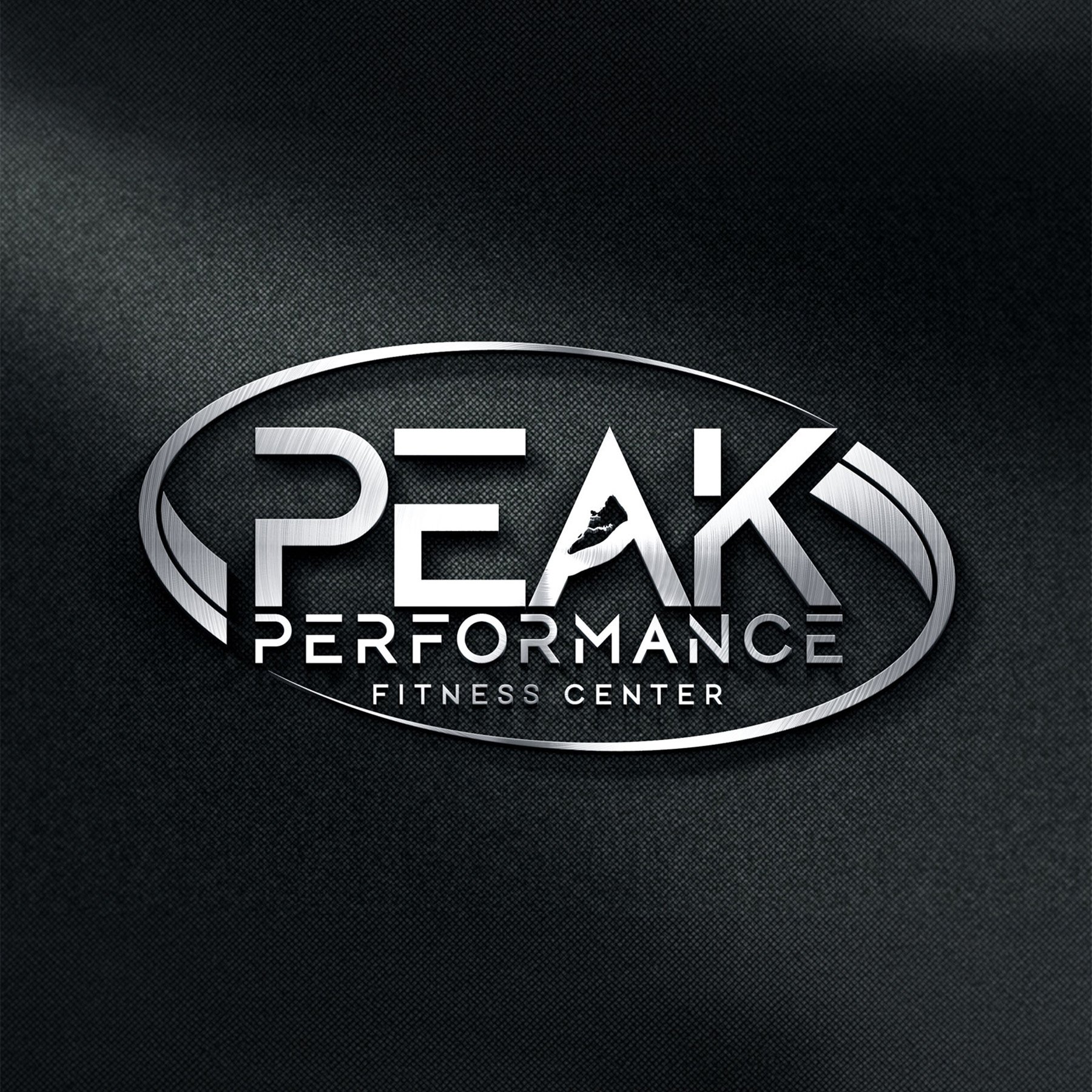 Close-up view of a logo on a dark textured background, reading 'PEAK PERFORMANCE FITNESS CENTER' with a stylized silver oval.