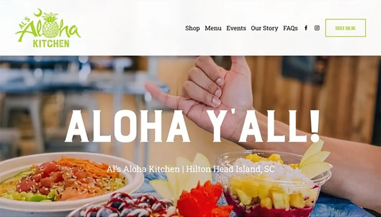 A Hawaiian restaurant's homepage showing a hand making the shaka sign with food including a salad and dessert on a table in front of it. The website header includes a green pineapple logo and menu options.