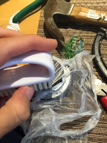 Smoothing the plastic with a brush
