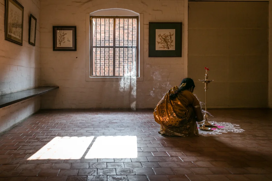 Women preparing for a ceremonial aarti (a fire ritual) in honor of a new exhibit by artist Ashesh Joshi.