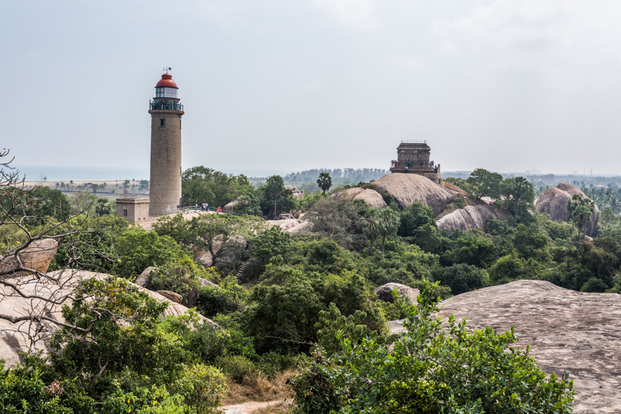 Mamallapurmal Hill features many archaeological sites sprawled throughout the rock-strewn terrain. The lighthouse on the left, functional since 1904, is now a tourist attraction. The square structure to the right of the lighthouse is the Olakaneeswara Temple dedicated to lord Shiva. It was also used as a lighthouse by the British until the modern structure was completed. Standing adjacent to the British-built lighthouse is India's oldest lighthouse, built around 640 AD by Pallava king Mahendra Pallava.