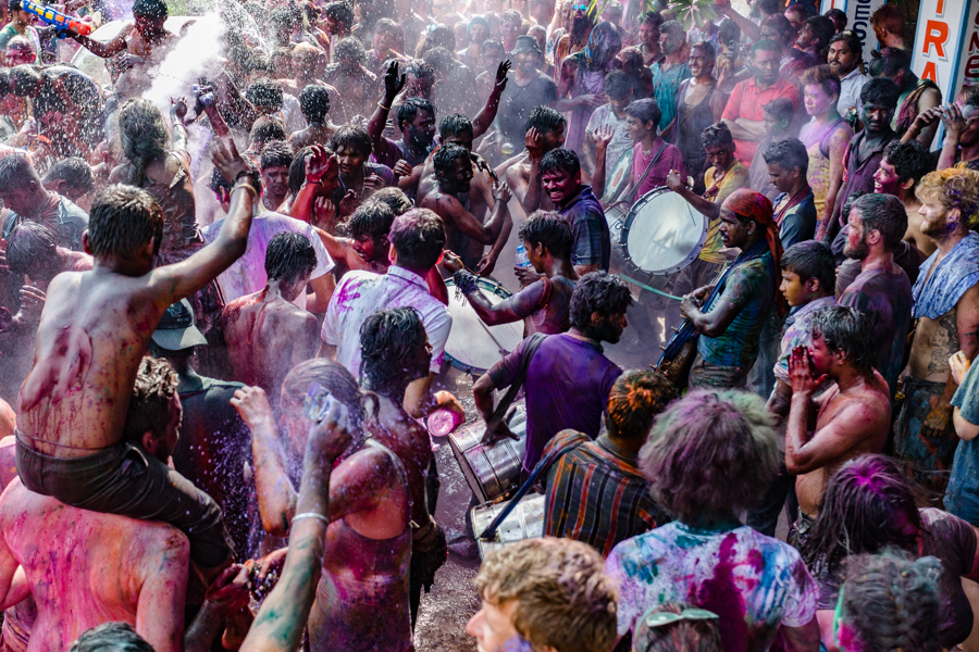 Holi revelers in Hampi.I nitially, Holi was celebrated by creating a bonfire and then the next day, when the fire had cooled down, people would apply ash to their foreheads. Eventually, color powder replaced ash and the color festival was born.