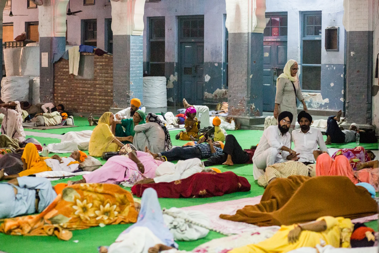 Pilgrims at the Golden Temple. The Temple accommodates thousands of pilgrims every week. There is even a special dormitory reserved for foreign travelers.&nbsp;
