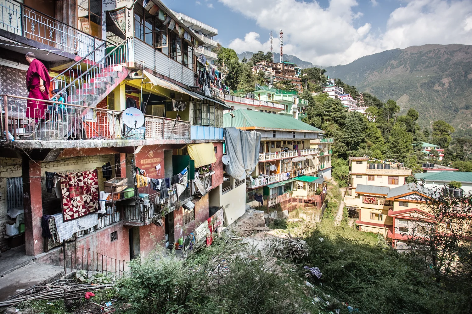 A monk descending the stairs of an apartment complex in Gangchen Kyishong, the capital of the Tibetan government in exile and spiritual center of Tibetan Buddhism. 