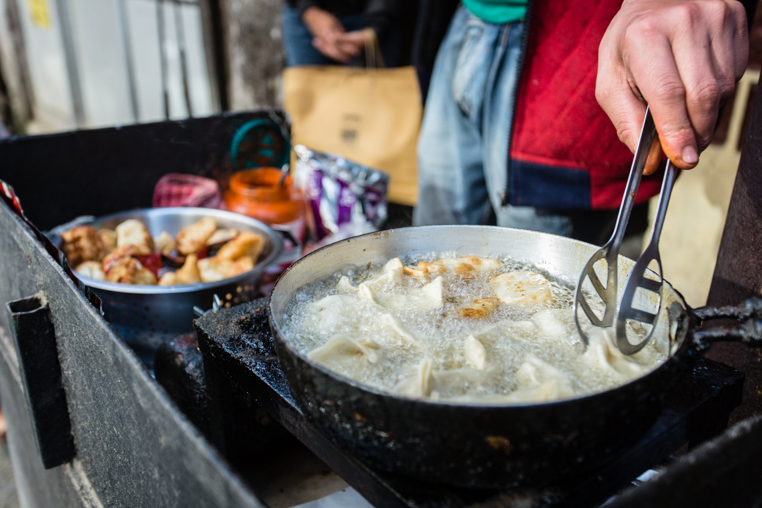 Momos, a Tibetan dumpling, are available on the cheap from street stalls.