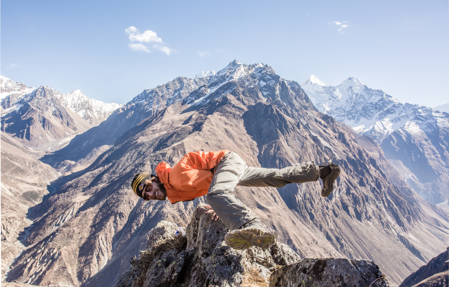 Popping a yoga pose in front the Ganesh ("elephant") massif, which border Tsum to the east. Photograph by Rob Fuldner.