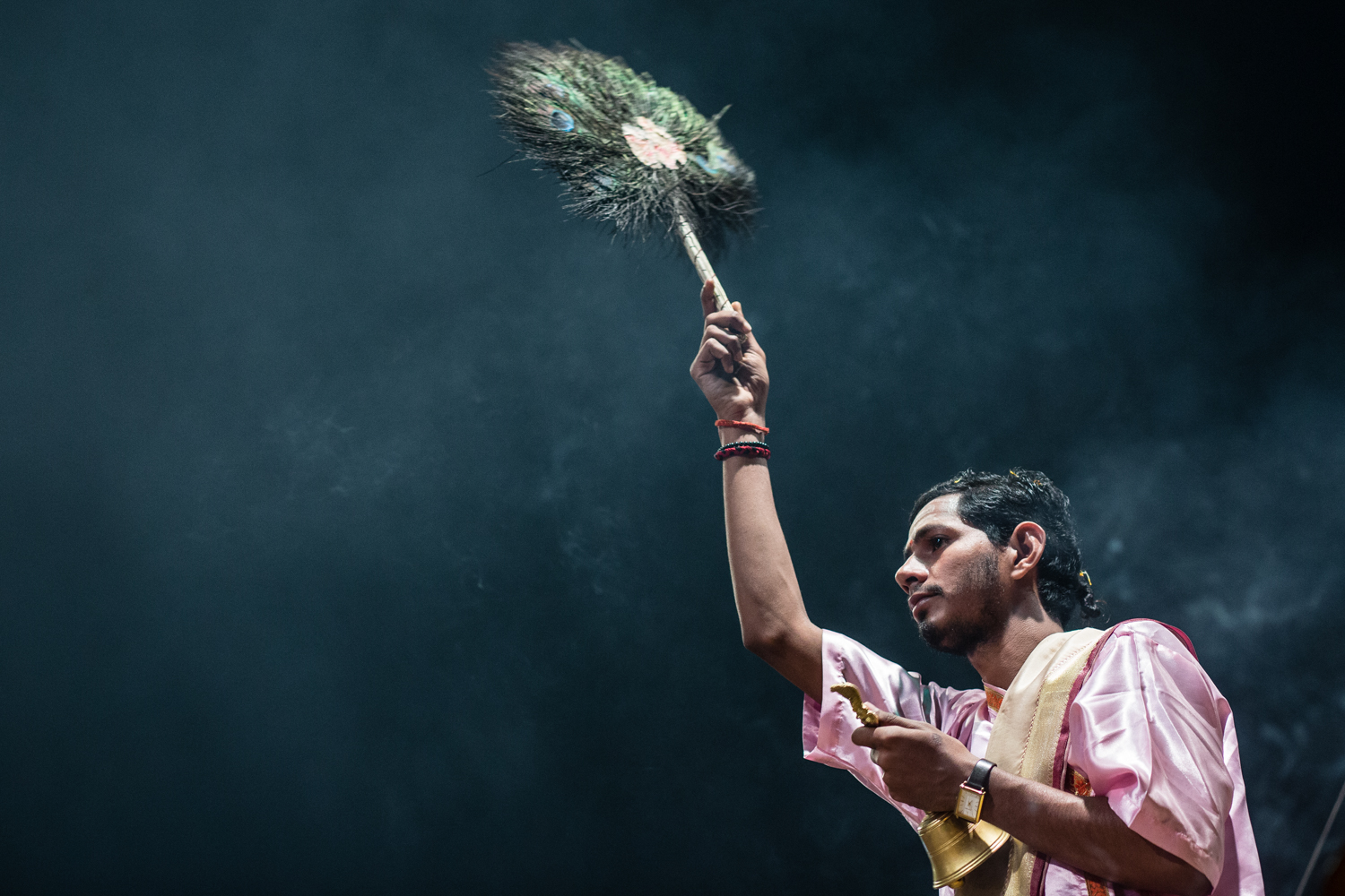 A priest participating in a Ganga Aarti. An Aarti is a ritual of Hindu worship usually performed at the end of a Pūjā — a prayer ceremony honoring Hindu deities or celebrating an event. During the ceremony, participants release oblations — usually in the form ghee soaked wicks — into the fire and chant devotional hymns.