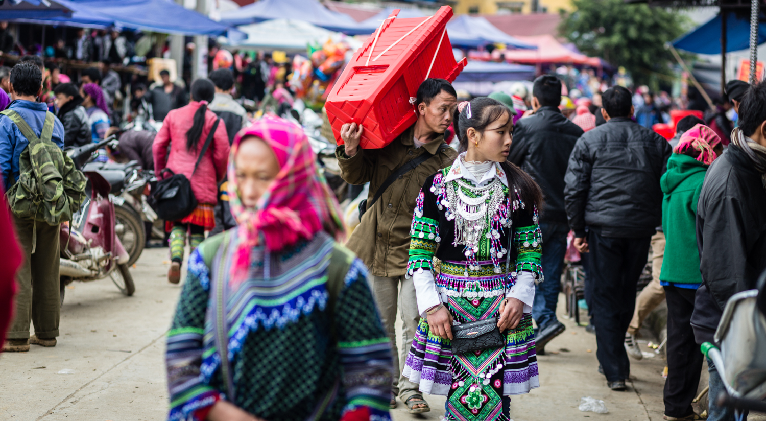 Villagers from all over the area flock to the Sunday Bac Ha market in Lao Coi Province. In addition to shopping for commodities ranging from meat to clothing, the market is very much a social occasion for the Flower Hmong, who go to the market dressed to impress