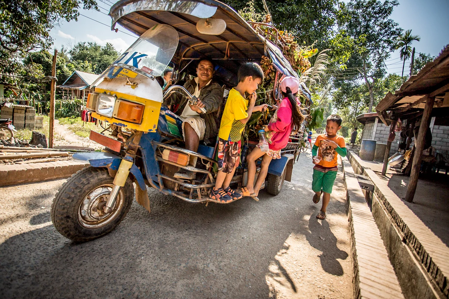 A party tuk-tuk in Xieng Men, a village opposite the Mekong River from Luang Prabang.