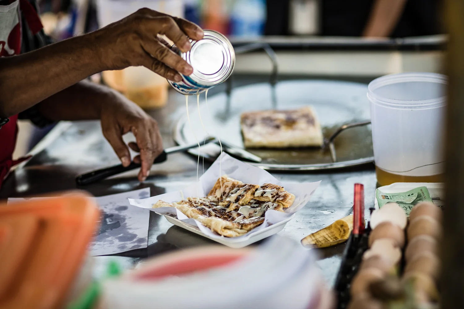 Roti pancakes—filled with egg and banana, and topped with condensed milk or powdered sugar—are a popular street food are a popular street snack in Thailand. 