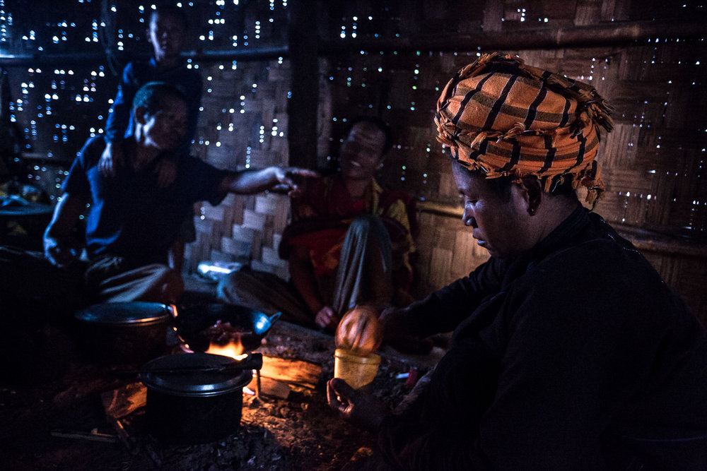  A women preparing dinner for her family.&nbsp;The villagers of Kyaut Su live in thatch houses.&nbsp; 