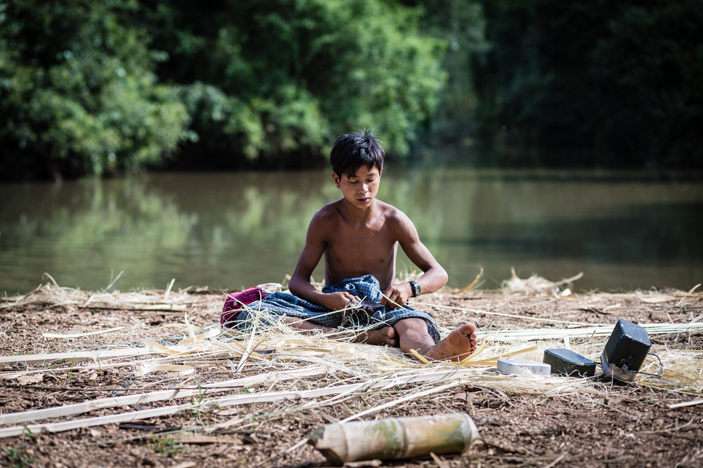  A boy preparing traditional baskets made from bamboo.&nbsp; 