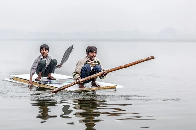Kite flying is a child's pastime in Varanasi, India. Ineluctably, they must find ways to retrieve their kites from the Ganges. 📷By Shalev Netanel @netanelphotography #varanasi #india #children #indian #boat #kite #travel #ganges #river #india #asia