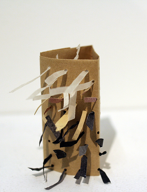 A STORY TOLD IN ONE DIRECTION Paper bag, paper scraps, brads 2014 2.5'' x 2.5'' x 1.5''