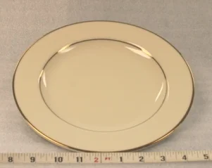 Ivory and Gold Dinner PlateHeight 1 1/4” Width 10”$0.70