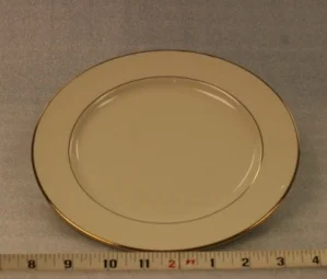 Ivory and Gold Luncheon PlateHeight 1" Width 9"$0.70