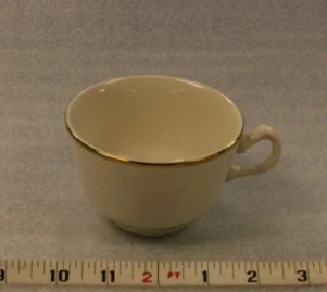 Ivory and Gold CupHeight 2 1/2" Width 3 3/4" Volume 6 oz.$0.70