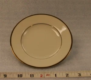 Ivory and Gold Bread and Butter PlateHeight 5/8" Width 5 3/4"$0.70
