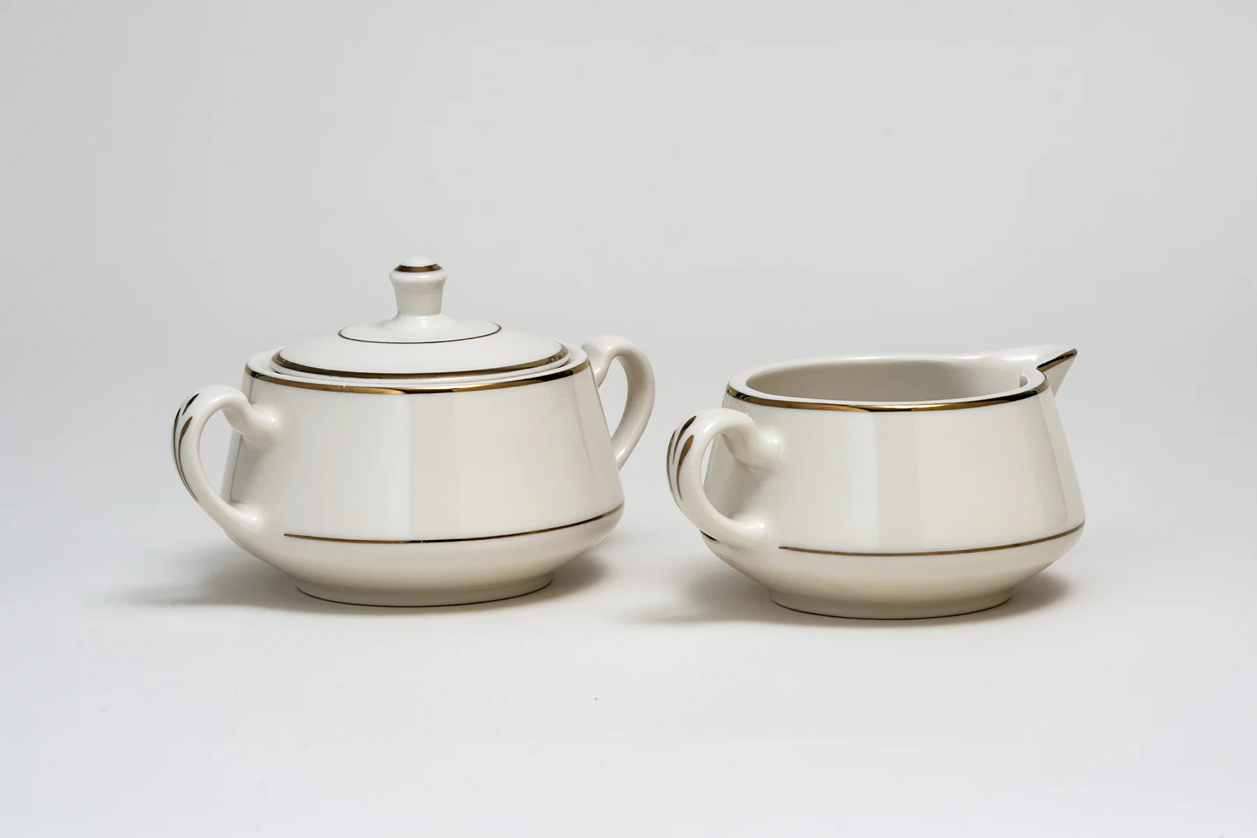 Ivory and Gold Sugar and Creamer$1.40/set