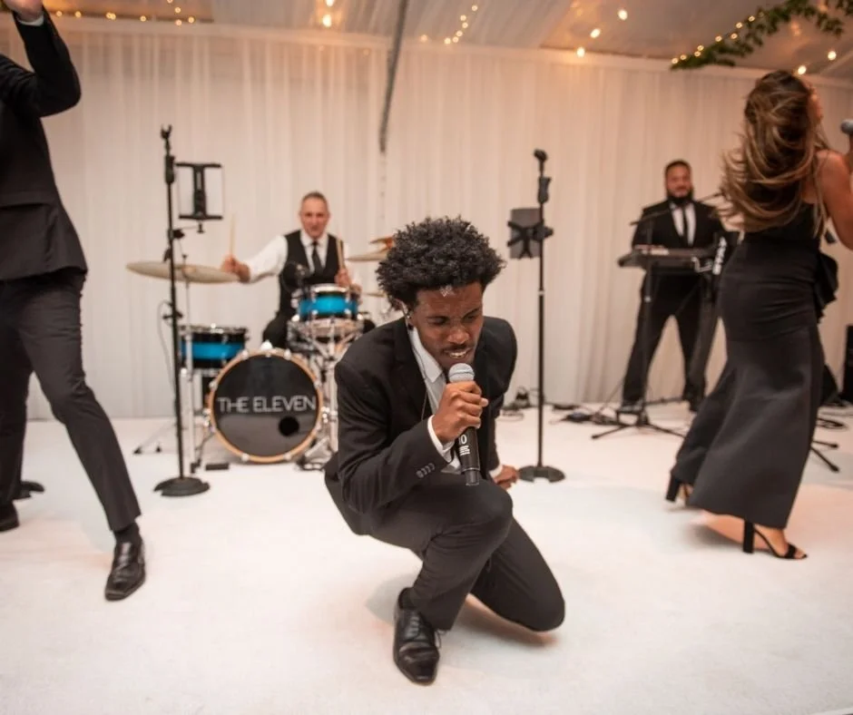 A band performing on a stage at a wedding in Vermont