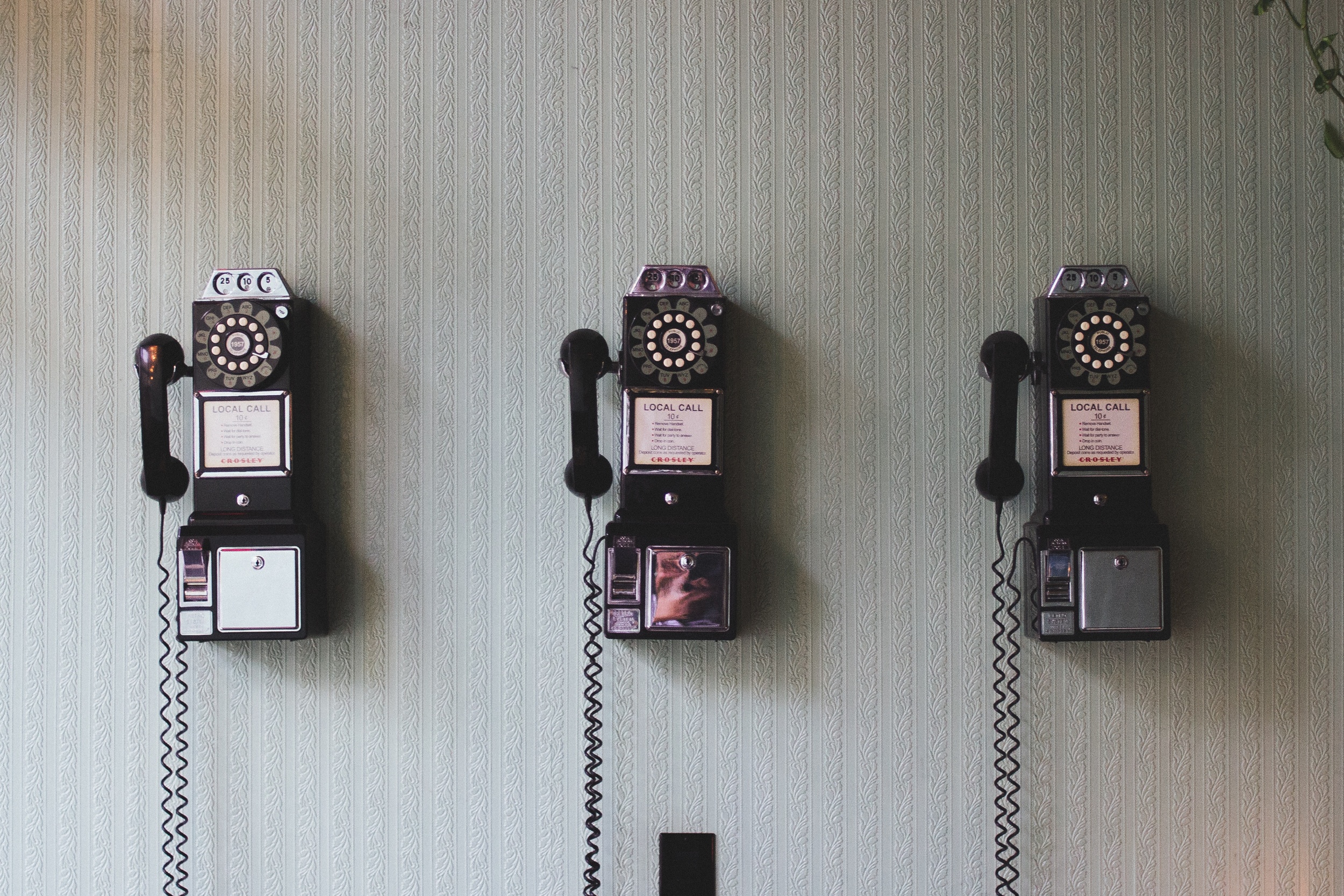 old phones on a wall.jpeg