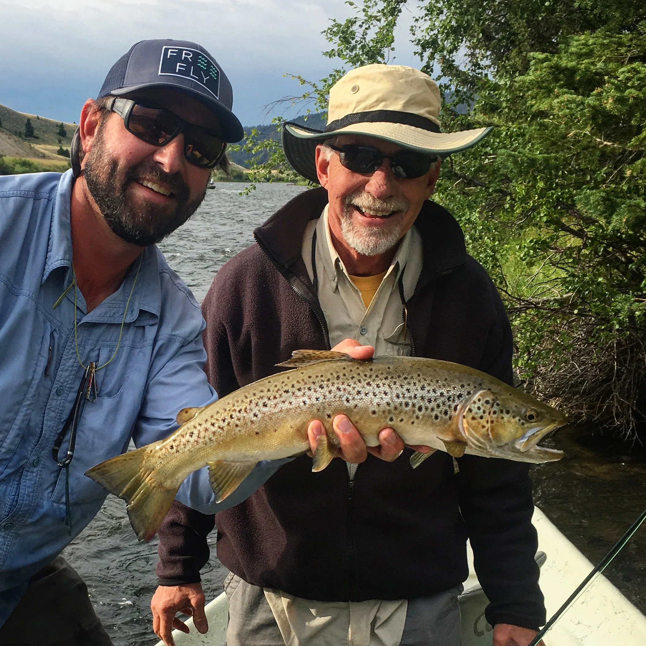 Rocky with a 21" Madison River Brown Trout on a dry fly