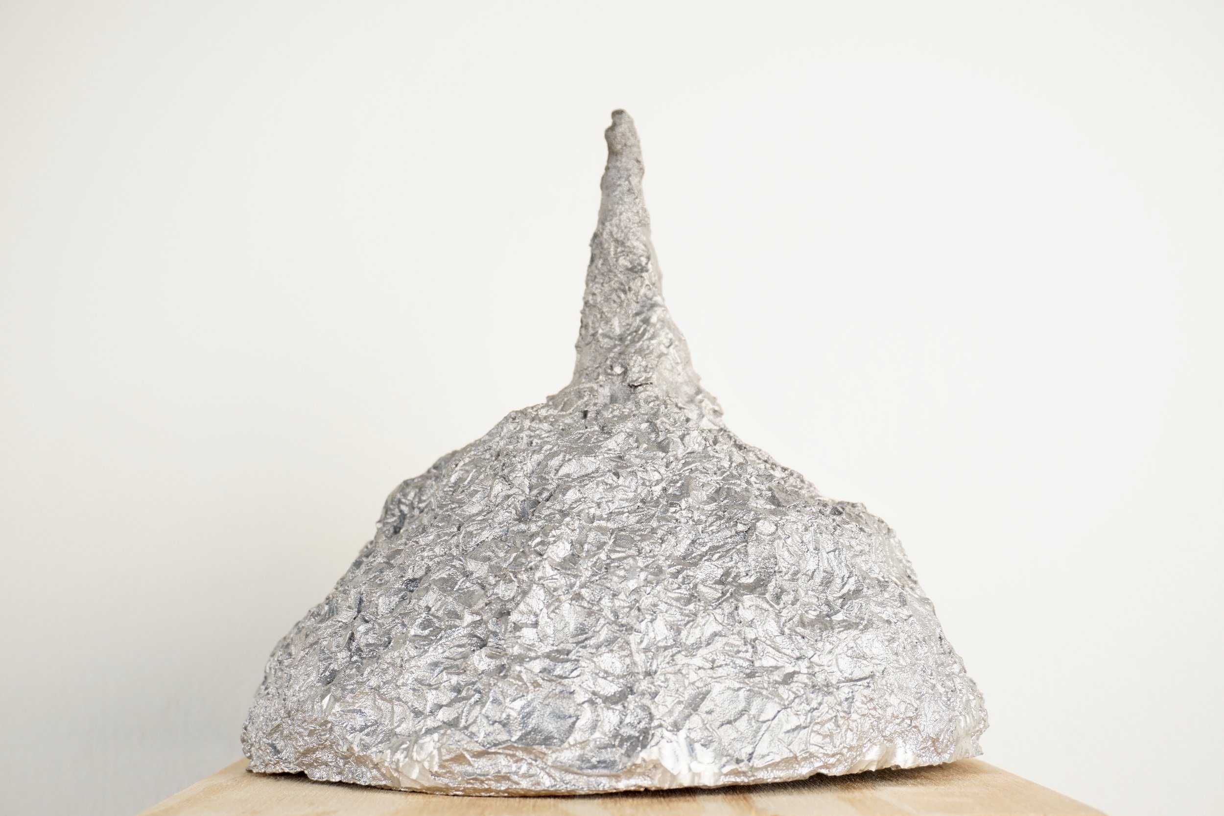 tin foil hat aluminum cast conspiracy theory art sculpture lukas liese.jpg