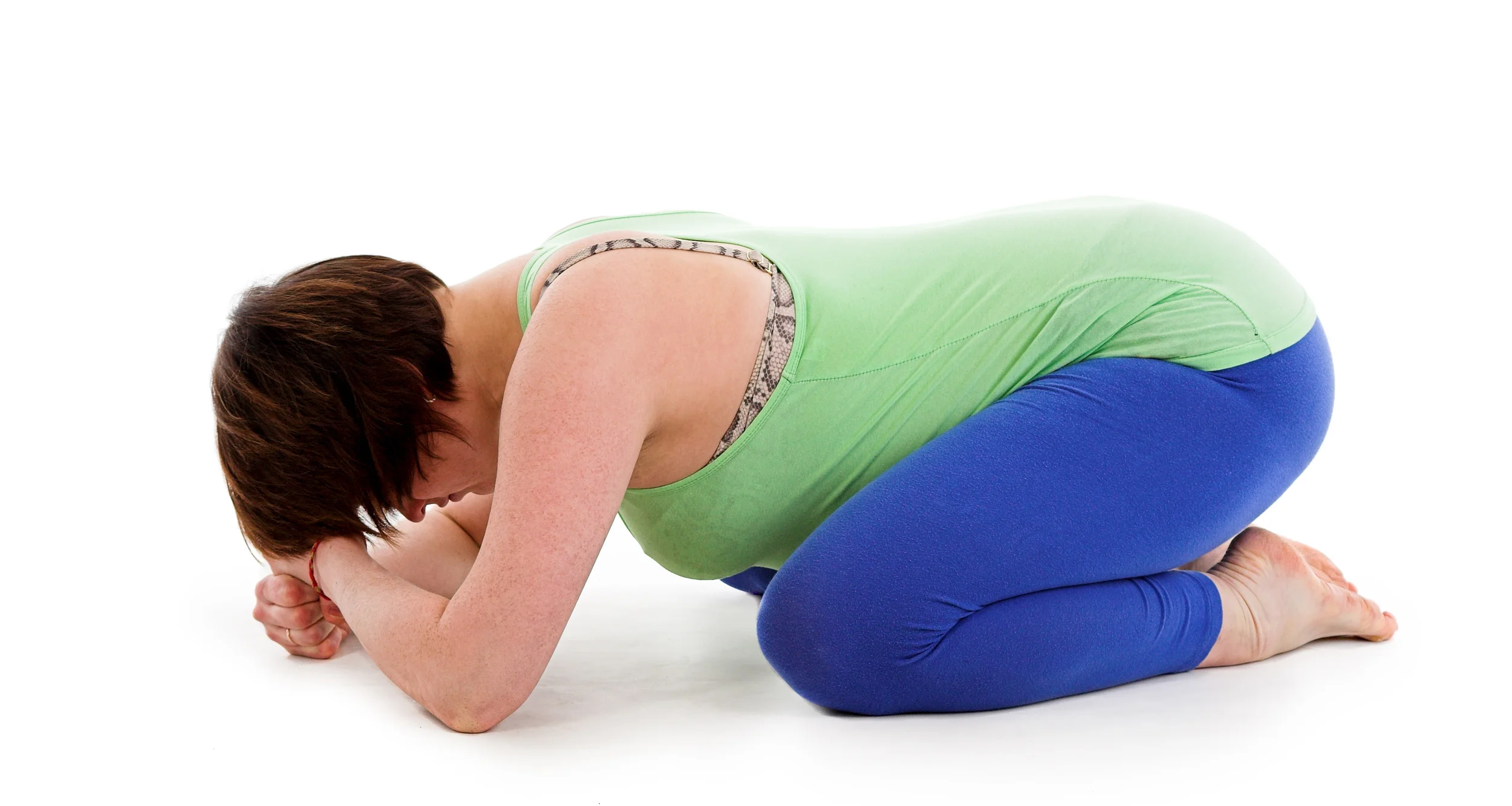 Make a fist with both hands and stack them one on top of the other. Rest your head on your stacked fists. The same rules apply, but your chin tuck will be the main stretching point for your upper body, now that your arms are not out stretched.