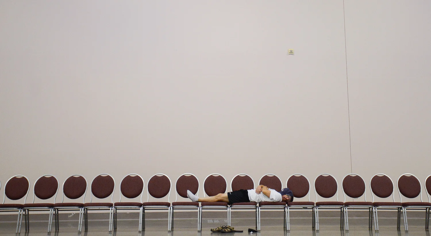  A National Senior Games athlete takes a nap during the volleyball competition at the National Senior Games held in the Minneapolis Convention Center, MN on July 11, 2015.&nbsp;    