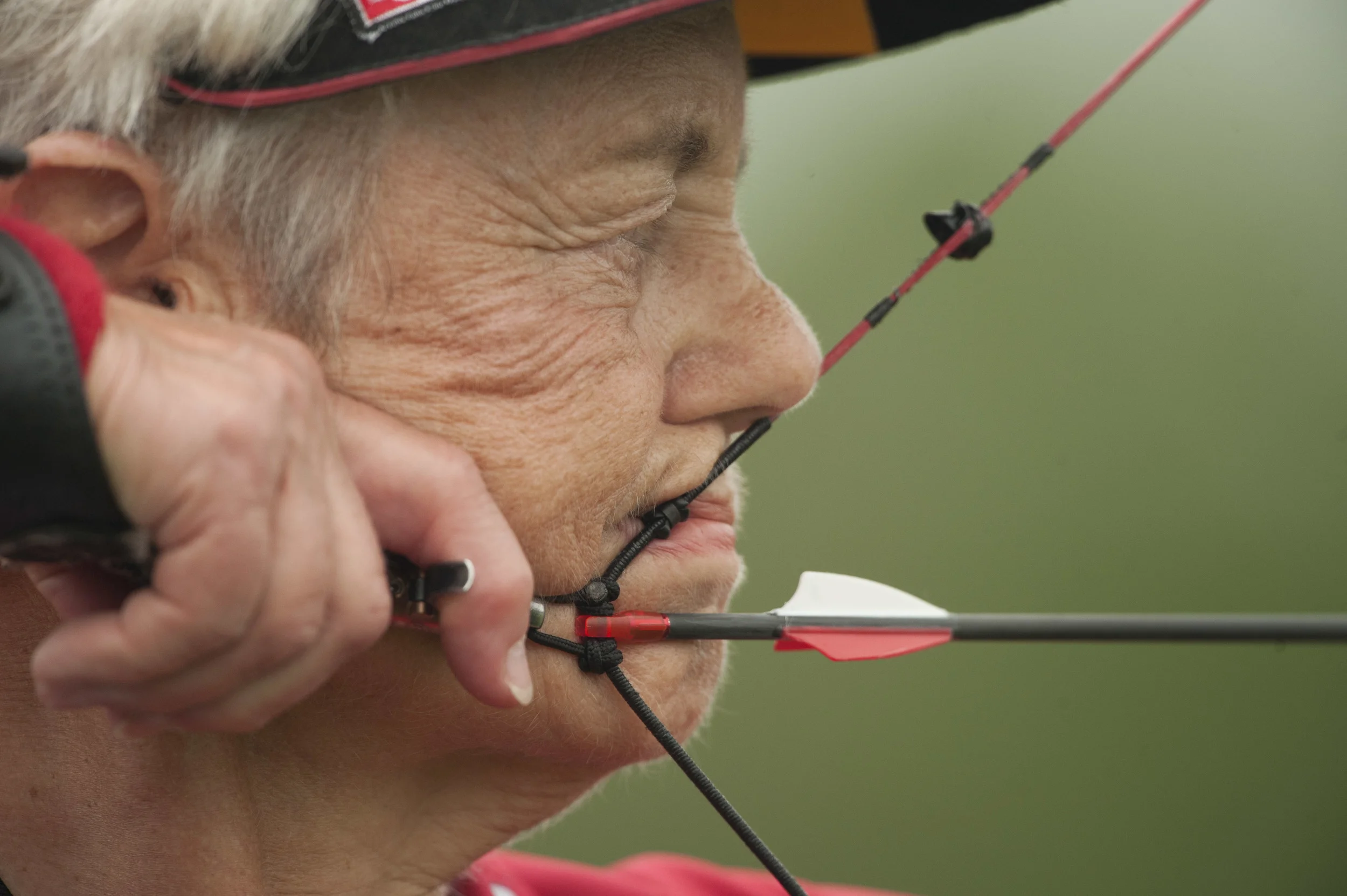  Defending gold medalist Diane Morris practices for the archery compound release competition at the National Senior Games on July 22, 2013 at the Laurel School-Butler Campus in Russell, OH. 