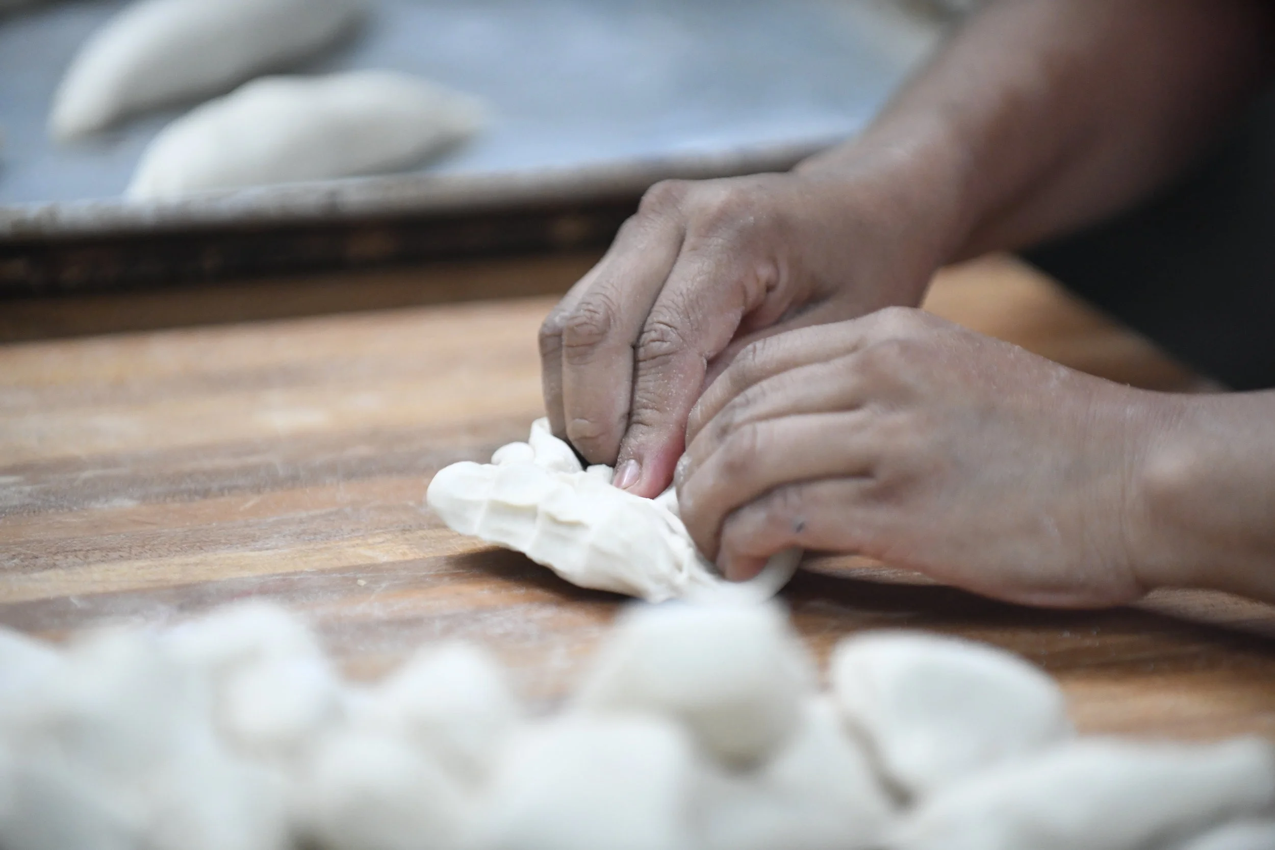  Lulu De La Garza kneads dough with her hands at General Teran Meat Market in Clute on Tuesday, Jan. 9, 2017. De La Garza notices people purchase more bread when it's cold outside. 
