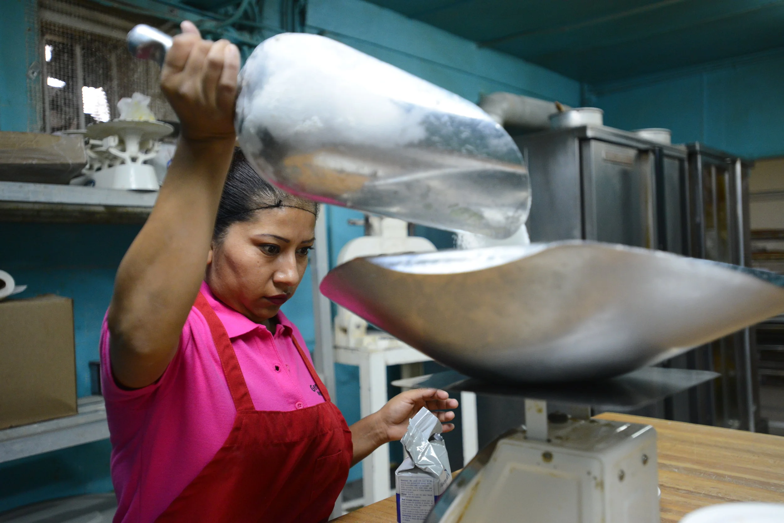  Lulu De La Garza weighs out ingredients to make sweet bread at her bakery in Clute on Tuesday, Jan. 9, 2017. De La Garza has worked 12 hour days during peak session. 