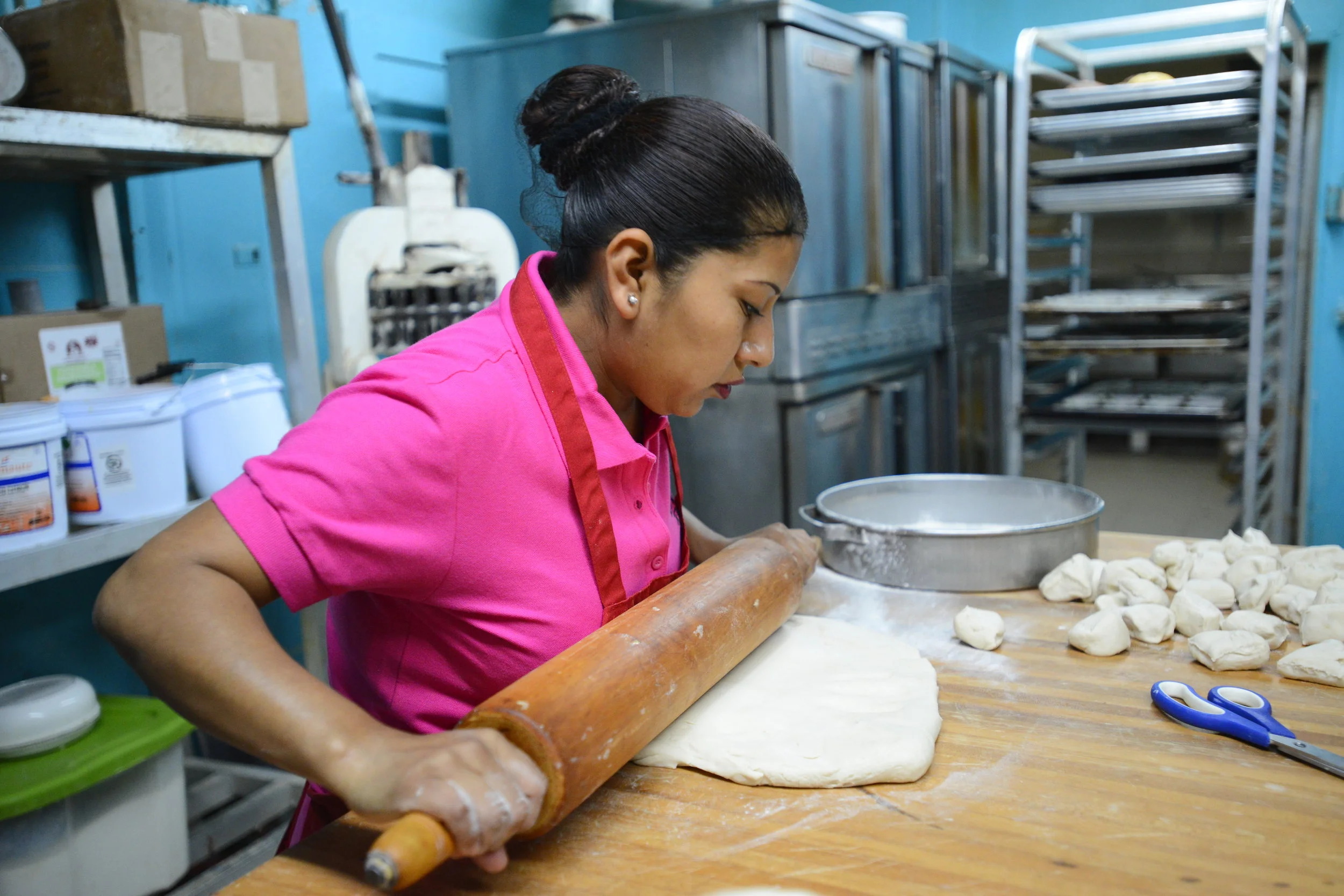  Lulu De La Garza uses a rolling pin to flatten the dough at her bakery in Clute on Tuesday, Jan. 9, 2017. Next, the dough will be cut into equal pieces. 