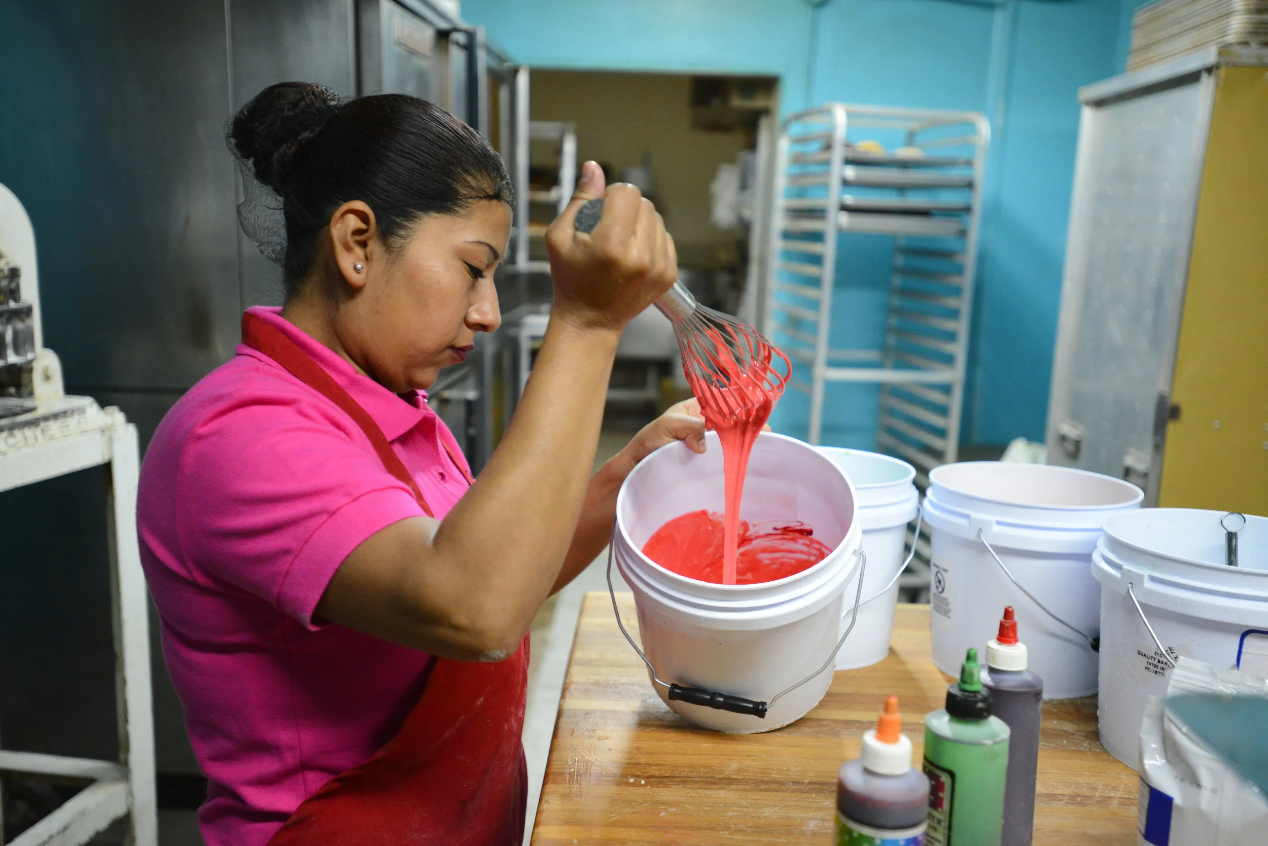  Lulu De La Garza mixes food dye into a batch of dough at her bakery in Clute on Tuesday, Jan. 9, 2017. Adding dye to the bread is a technique she learned when visiting Mexico. 