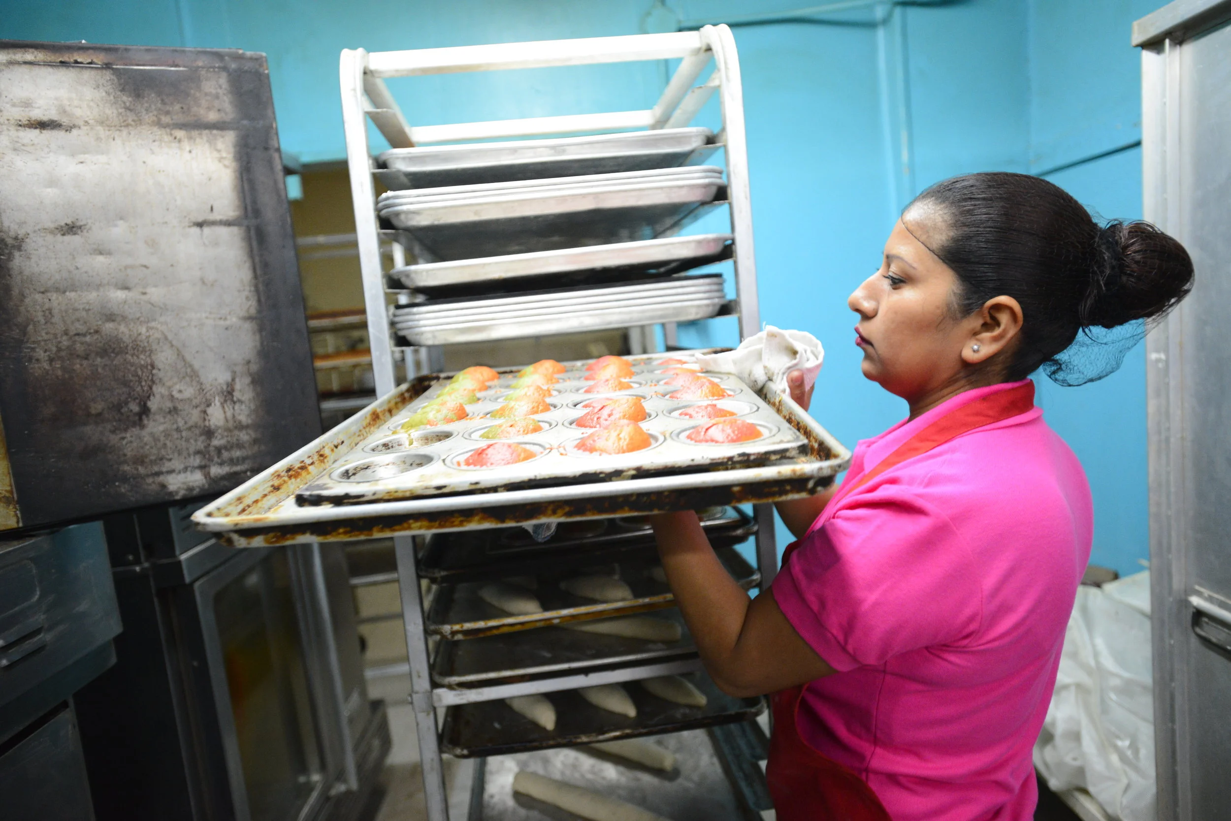  Lulu De La Garza pulls out freshly made muffins from the oven at her bakery in Clute on Tuesday, Jan. 9, 2017.&nbsp; 