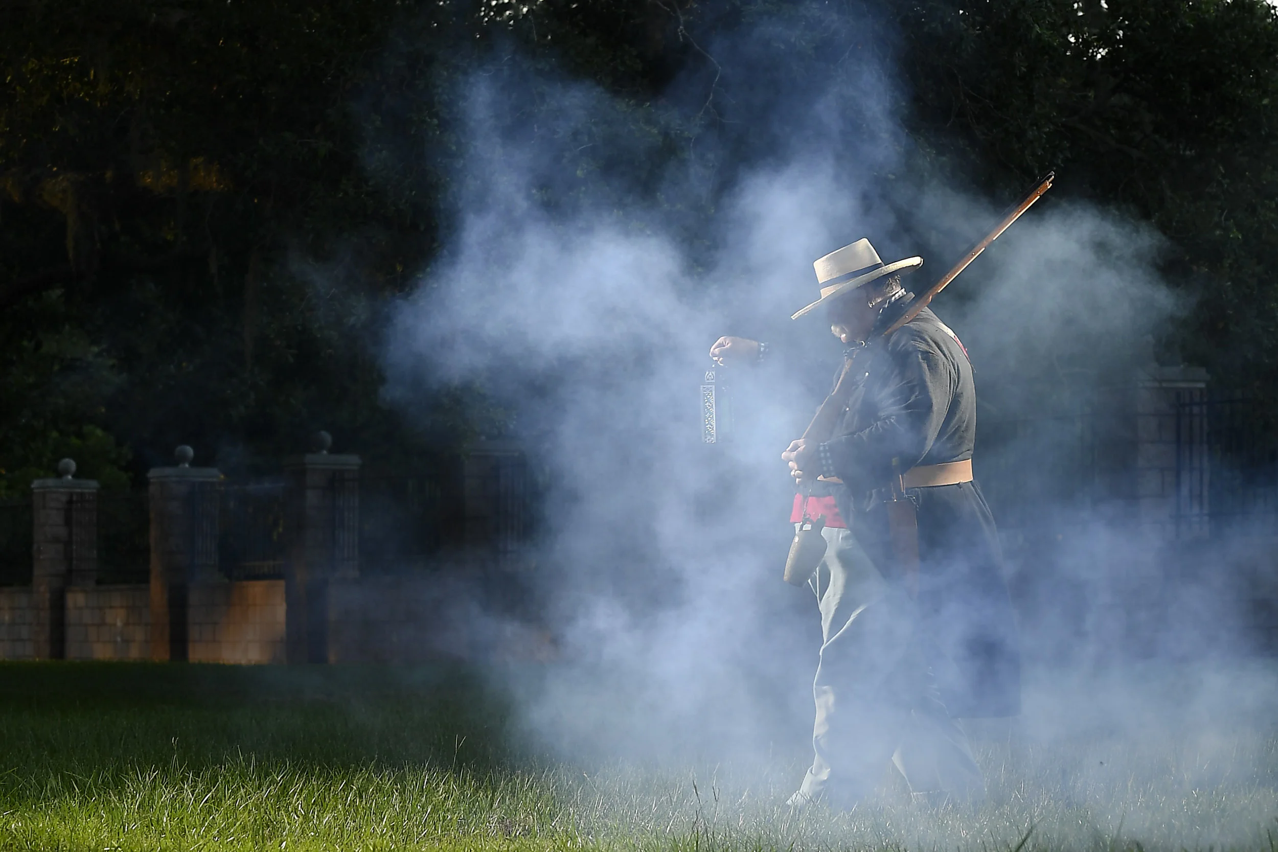  Michael Bailey plays the ghost of Brit Bailey as he looks for his long-lost jug of whiskey during a historical reenactment at Munson Cemetery in Angleton, Texas, on Monday, Aug. 28, 2018. 