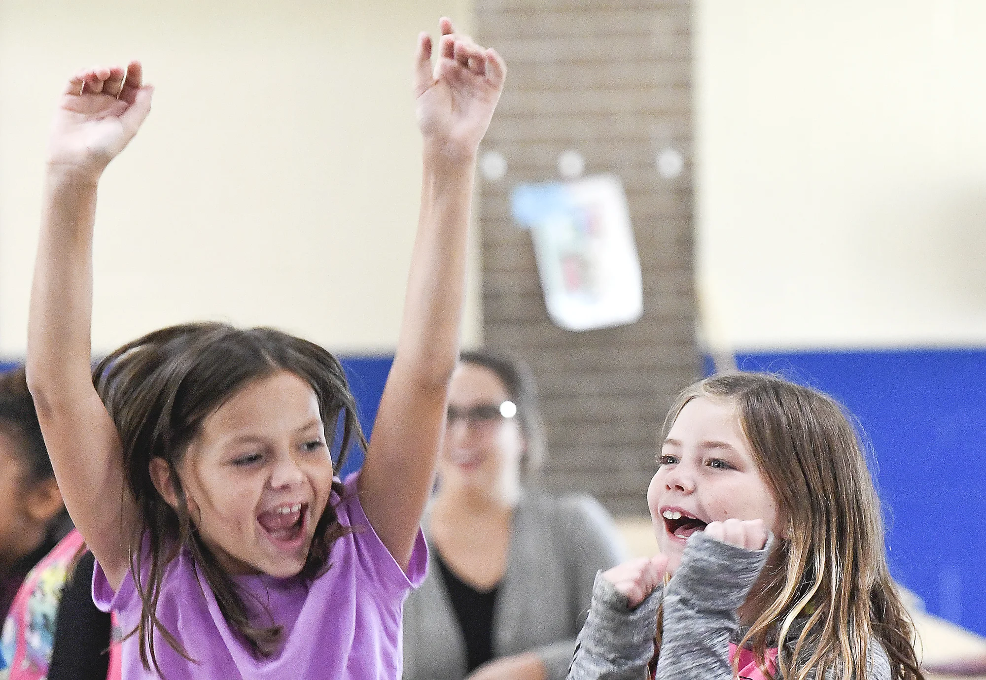 Brianna Runge, left, and Baylee Watkins cheer on their teachers during the Sweeny Elementary School sorting ceremony on Friday, Aug. 24, 2018. Students are mixed together and broken up into four sections led by teachers. 