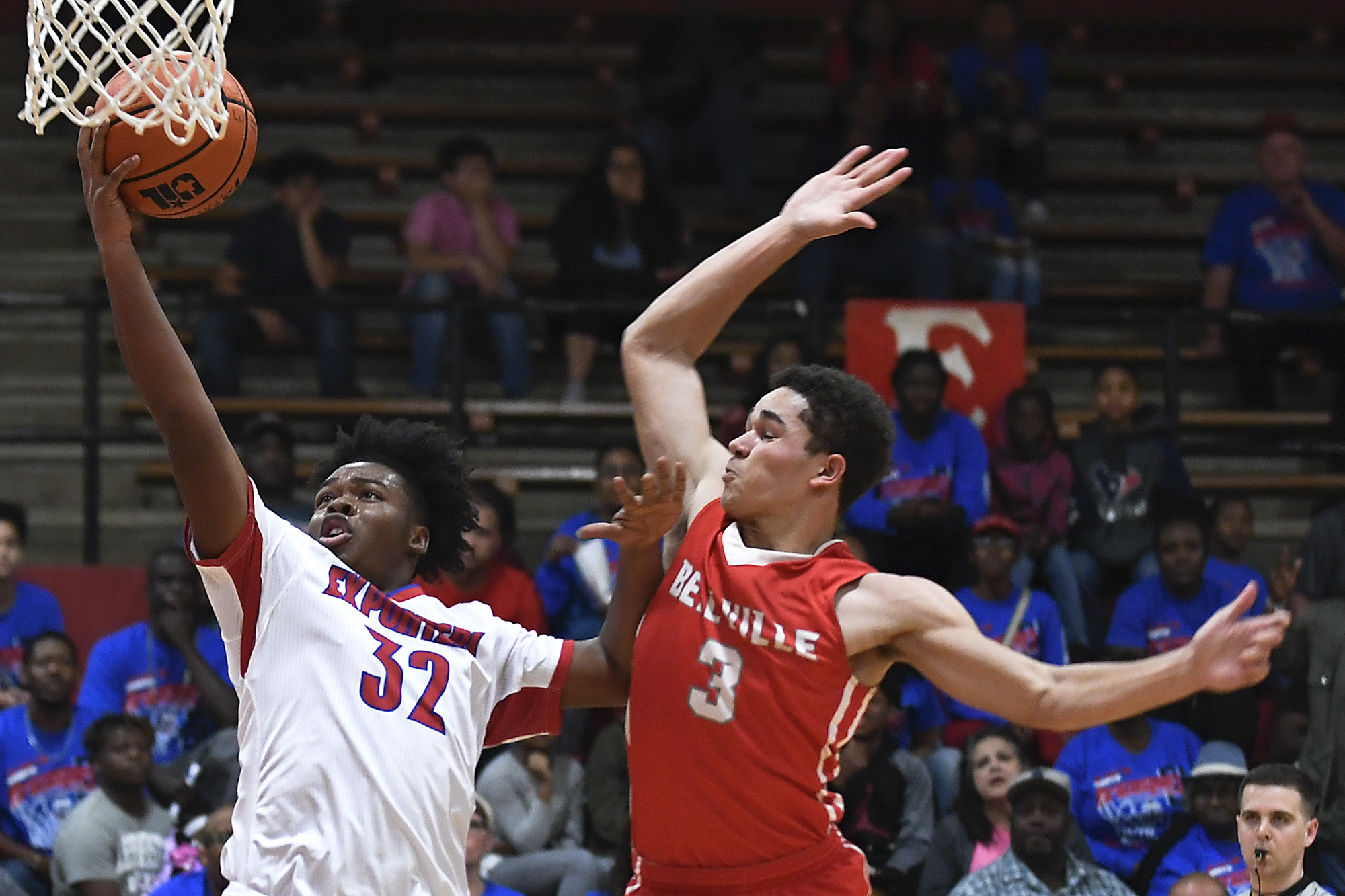  Brazosport High School's Tre'von Ramsey (32) goes for a layup on a fast break as Bellville's Marcus Ward (3) tries to block him during the 26-4A and 25-4A bi-district playoff game at El Campo High School on Tuesday, Feb. 20, 2018 against Bellville. 
