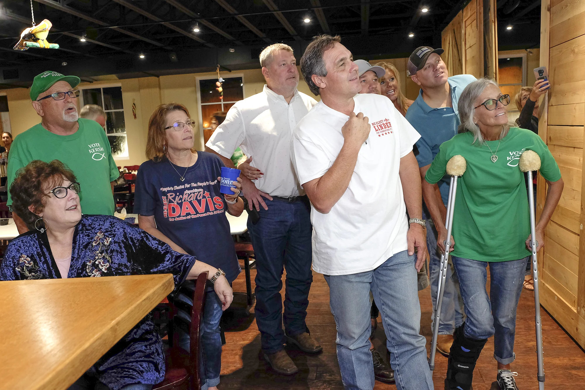  Republican candidates and supporter, including Precinct 4 Commissioner David Linder, Center, and Justice of the Peace Sherry Kersh, right, watch live coverage of the general election results Tuesday, Nov. 7, 2018 at El Patio in Angleton. Both Linder