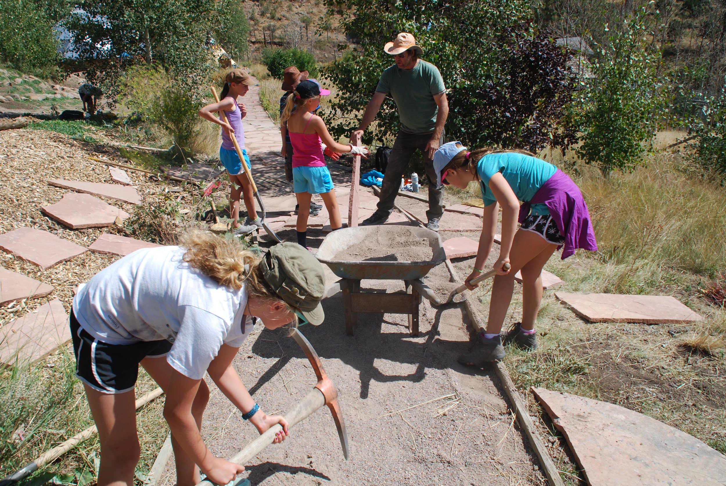 Building a flagstone walk at Mission:Wolf.